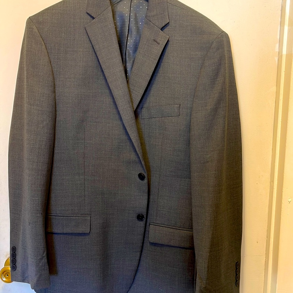 Men’s suit in gray colored  by Michael Strahan.